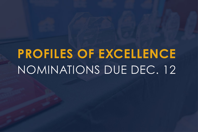 “Awards displayed on a table with text reading ‘Profiles of Excellence – Nominations due Dec. 12.’”