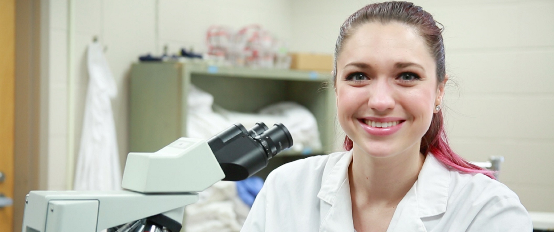 medical tech looking at camera smiling
